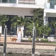 JLo is ethereal in white while Ben Affleck puffs on a cigarette as couple relax at lavish Miami Beach mansion.