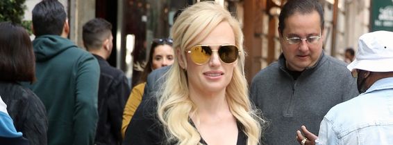 EXCLUSIVE: Rebel Wilson Heads To The Airport In A Casual Black Top, Pants And Flats - Carrying A Small Leather Tote, In New York City