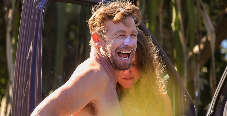 EXCLUSIVE: *NO DAILYMAIL ONLINE* Simon Baker Suffers A Cheeky Wetsuit Wardrobe-Malfunction During A Surf Session With Girlfriend Laura May Gibbs In Byron Bay