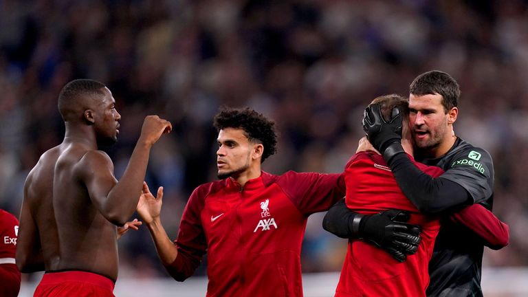 Liverpool goalkeeper Alisson Becker hugs a team-mate at the end of the Premier League match at Tottenham Hotspur Stadium, London. Picture date: Saturday September 30, 2023.