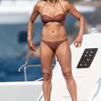 *PREMIUM-EXCLUSIVE* MUST CALL FOR PRICING BEFORE USAGE - STRICTLY NOT AVAILABLE FOR ONLINE USAGE UNTIL 22:20 PM UK TIME ON 24/08/2021 - The American Actress Michelle Rodriguez shows off her voluptuous sexy figure as she soaks up the hot Italian sunshine