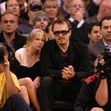 Michelle Williams and Heath Ledger watch the L.A. Lakers