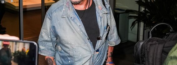 Johnny Depp steps out the Milan airport after the Rome film festival before a TV interview on channel 9