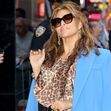 Eva Mendes arrives at GMA in a leopard print dress and blue coat in New York City