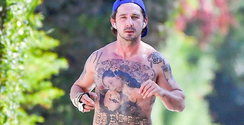 EXCLUSIVE: Shia LaBeouf still has an injured right hand as he takes a shirtless walk around his neighborhood