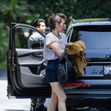 EXCLUSIVE: Mila Jovovich shows of an interesting new hairstyle as she arrives at the Four Seasons