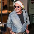 Johnny Depp steps out the Milan airport after the Rome film festival before a TV interview on channel 9