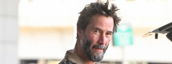 *EXCLUSIVE* A scruffy Keanu Reeves touches down at JFK!