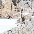 Michelle Rodriguez takes in the French sunshine as she relaxes by the pool at the Cap Eden Roc hotel during 79th Cannes Film Festival.