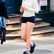 *EXCLUSIVE* *Suri Cruise enjoys a spring time solo stroll in New York with headphones. Looking relaxed and sporty in short shorts and sneakers.