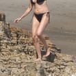 *EXCLUSIVE* 'Boogie Nights' actress Heather Graham slips into a black bikini for a beachside frolic next to mystery man