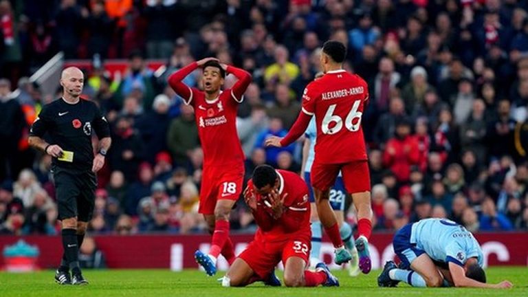 Liverpool's Joel Matip reacts after being shown a yellow card during the Premier League match at Anfield, Liverpool. Picture date: Sunday November 12, 2023.