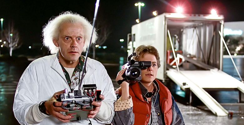 USA. Michael J. Fox and Christopher Lloydin a scene from ©Universal Pictures  film:  Back to the Future (1985).Plot: Marty McFly, a 17-year-old high school student, is accidentally sent thirty years into the past in a time-traveling DeLorean invented by