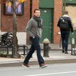 Bradley Cooper wears a knitted scarf as a jacket in New York City