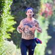 EXCLUSIVE: Shia LaBeouf still has an injured right hand as he takes a shirtless walk around his neighborhood