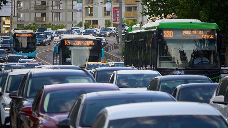 Bucharest, Romania - May 24, 2024: Cars in traffic at rush hour on a boulevard in Bucharest.