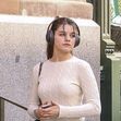 *EXCLUSIVE* Suri Cruise enjoys a spring time solo stroll in New York with headphones. Looking relaxed and sporty in short shorts and sneakers.