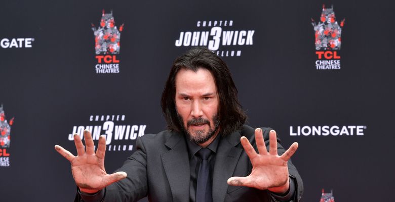 Keanu Reeves Places His Hand Prints In Cement At TCL Chinese Theatre IMAX Forecourt