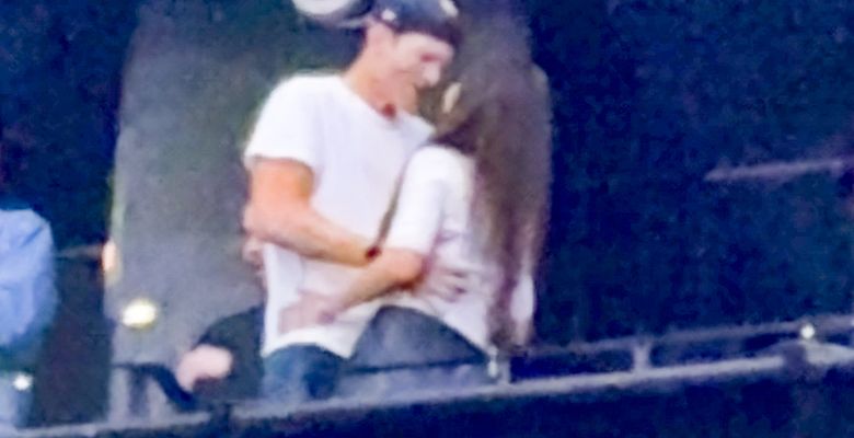 Ashton Kutcher and Mila Kunis at the Backstreet Boys concert