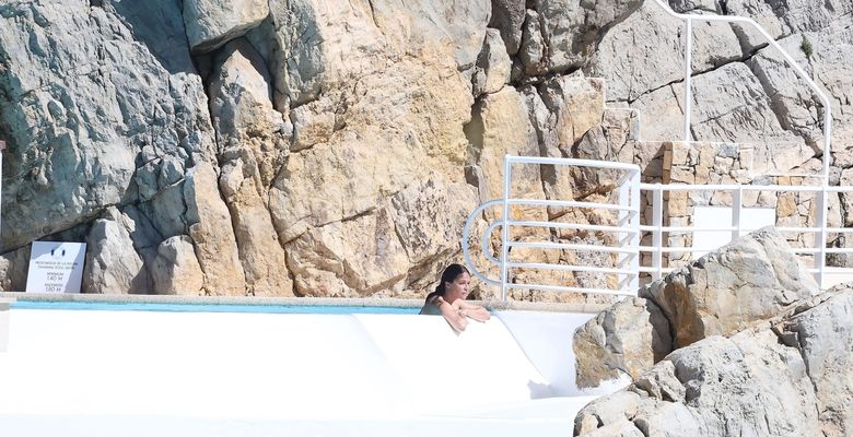 Michelle Rodriguez takes in the French sunshine as she relaxes by the pool at the Cap Eden Roc hotel during 79th Cannes Film Festival.