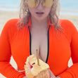 Rebel Wilson Hits the Beach in Neon Orange Swimsuit During Tropical Vacation: 'Find Me in Fiji'