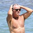 EXCLUSIVE: Pierce Brosnan takes off his shirt and takes a dip while in Hawaii