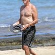 EXCLUSIVE: Pierce Brosnan takes off his shirt and takes a dip while in Hawaii
