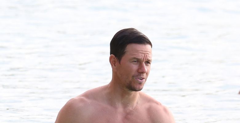 Actor Mark Wahlberg shows off his bulging biceps at the beach in Barbados