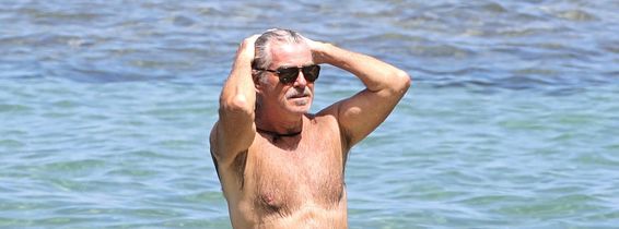 EXCLUSIVE: Pierce Brosnan takes off his shirt and takes a dip while in Hawaii