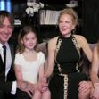 Tina Fey and Amy Poehler kick off the Golden Globes from opposite sides of the US