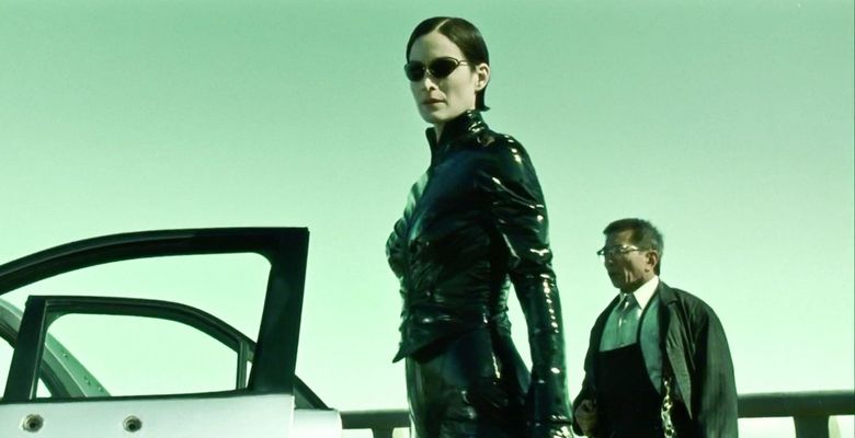 USA. Randall Duk Kim and Carrie-Anne Moss in a scene from the ©Warner Bros film : The Matrix Reloaded (2003).Plot: Neo and his allies race against time before the machines discover the city of Zion and destroy it. While seeking the truth about the Matrix