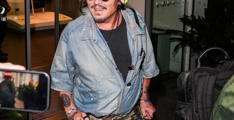Johnny Depp steps out the Milan airport after the Rome film festival before a TV interview on channel 9