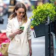*EXCLUSIVE* British actress Emilia Clarke cuts a stylish figure in a Beige shoulder-padded jacket with a matching beige skirt as she's seen out and about in Soho, London.
