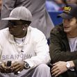 Sean "P. Diddy" Combs and Ashton Kutcher sit courtside