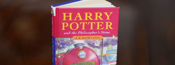 A pristine first edition hardback of JK Rowling's Harry Potter and the Philosopher's Stone, one of only 500 produced in the first print run in 1997, on display at Hansons' Auctioneers at Bishton Hall, Staffordshire. The book has never been read and was ke