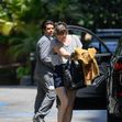 EXCLUSIVE: Mila Jovovich shows of an interesting new hairstyle as she arrives at the Four Seasons