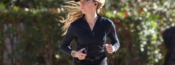 American actress Amber Heard is all smiles while out jogging in Madrid after announcing she is expecting her second child