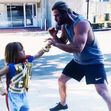 Chris Hemsworth boxing with his seven year old son on the set of Thor