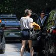 EXCLUSIVE: Mila Jovovich shows of an interesting new hairstyle as she arrives at the Four Seasons