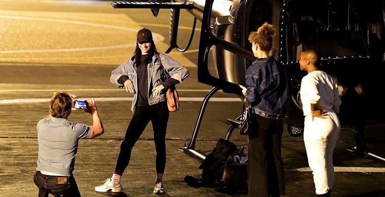 *EXCLUSIVE* WEB MUST CALL FOR PRICING  - Piloting a few friends on his chopper, The American All Action Hero Tom Cruise proves he has many strings to his bow by taking a few snaps of his guests as he arrived at the Battersea Heliport.