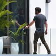 Jennifer Lopez and Ben Affleck are seen on the upstairs balcony of her rental home in Miami